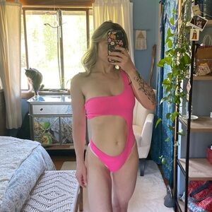 neon pink asymmetrical one piece suit